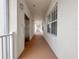 Clean hallway with elevator access and windows at 7521 Mourning Dove Cir # 303, Reunion, FL 34747