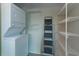 Stackable washer and dryer in laundry area with shelving at 10 N Summerlin Ave # 26, Orlando, FL 32801