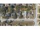An aerial view showing homes nestled among trees in a residential neighborhood at 1001 Willow Run St., Minneola, FL 34715