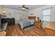 Well-lit bedroom with wood floors, ceiling fan, and charming decor for a cozy and inviting space at 1001 Willow Run St., Minneola, FL 34715