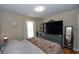 Cozy bedroom features a plush bed, a large dresser, and a relaxing atmosphere at 1001 Willow Run St., Minneola, FL 34715