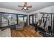 Bright bonus room with a ceiling fan, wood floors, and views of the backyard at 1001 Willow Run St., Minneola, FL 34715