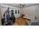 Cozy bonus room featuring a ceiling fan, French doors to the exterior, and versatile exercise equipment at 1001 Willow Run St., Minneola, FL 34715