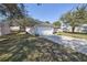 A side view of a home showing the driveway and the lawn at 1001 Willow Run St., Minneola, FL 34715