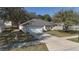 An elevated shot of a well-maintained home featuring a long driveway at 1001 Willow Run St., Minneola, FL 34715