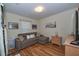 Comfortable living room with a sleeper sofa, and a cozy atmosphere perfect for relaxation at 1001 Willow Run St., Minneola, FL 34715