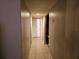 Long hallway with tiled floor and doors at 1040 Maxey Dr, Winter Garden, FL 34787