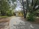 Yellow house exterior with a driveway at 1040 Maxey Dr, Winter Garden, FL 34787