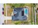 Overhead view of house with gray roof and pool in backyard at 10446 Summit Lakes Ln, Clermont, FL 34711