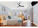 Main bedroom with wood floors and plenty of natural light at 10446 Summit Lakes Ln, Clermont, FL 34711