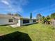 View of house exterior and backyard at 115 Cardamon Dr, Orlando, FL 32825