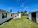 View of backyard with shed and house exterior at 115 Cardamon Dr, Orlando, FL 32825