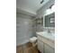Clean bathroom, shower, toilet and vanity with storage at 115 Cardamon Dr, Orlando, FL 32825