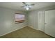 Cozy bedroom with tile flooring and a ceiling fan at 115 Cardamon Dr, Orlando, FL 32825
