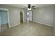 Bedroom with tile flooring, a ceiling fan and private bathroom at 115 Cardamon Dr, Orlando, FL 32825