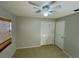 Bright bedroom with ceiling fan, window coverings, and tiled floor at 115 Cardamon Dr, Orlando, FL 32825
