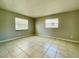 Spacious bedroom with tile floors and neutral wall paint at 115 Cardamon Dr, Orlando, FL 32825