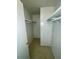 Spacious closet with wood shelving and hanging rod at 115 Cardamon Dr, Orlando, FL 32825
