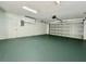 Attached garage with painted floor and extra storage at 115 Cardamon Dr, Orlando, FL 32825