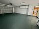 Attached garage with painted floor and extra storage at 115 Cardamon Dr, Orlando, FL 32825