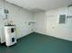 Attached garage with painted floor and extra storage at 115 Cardamon Dr, Orlando, FL 32825