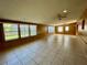 Spacious Gathering room with tile flooring and large windows at 115 Cardamon Dr, Orlando, FL 32825