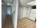 Clean hallway with tile flooring and neutral walls at 115 Cardamon Dr, Orlando, FL 32825