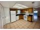 Bright kitchen featuring wood cabinets and modern appliances at 115 Cardamon Dr, Orlando, FL 32825