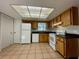 Bright kitchen featuring wood cabinets and modern appliances at 115 Cardamon Dr, Orlando, FL 32825