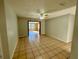Living room with tile floors and access to sunroom at 115 Cardamon Dr, Orlando, FL 32825