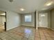 Spacious living room featuring neutral walls and tile flooring at 115 Cardamon Dr, Orlando, FL 32825