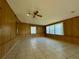 Spacious sunroom with wood paneling and windows at 115 Cardamon Dr, Orlando, FL 32825