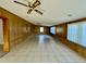 Sunroom with tile floor and wood paneling at 115 Cardamon Dr, Orlando, FL 32825