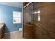 Bathroom with a large shower and grab bars at 115 N Lake Florence Dr, Winter Haven, FL 33884