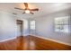 Bright bedroom with hardwood floors and built-in shelving at 115 N Lake Florence Dr, Winter Haven, FL 33884
