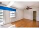 Bedroom with hardwood floors, water views, and built-in closet at 115 N Lake Florence Dr, Winter Haven, FL 33884