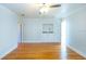 Bright bedroom with hardwood floors and built-in shelving at 115 N Lake Florence Dr, Winter Haven, FL 33884