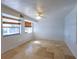 Large bonus room with tile floors and two windows at 115 N Lake Florence Dr, Winter Haven, FL 33884
