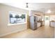 Modern kitchen with water views and stainless steel fridge at 115 N Lake Florence Dr, Winter Haven, FL 33884