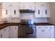 Stainless steel appliances and white cabinets at 115 N Lake Florence Dr, Winter Haven, FL 33884