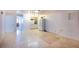 Small kitchenette with refrigerator and white cabinetry at 115 N Lake Florence Dr, Winter Haven, FL 33884