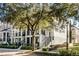 Two-story townhome with a front porch and landscaping at 1197 Orange Ave, Winter Springs, FL 32708