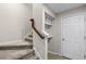 Carpeted staircase with built-in shelving and storage at 1197 Orange Ave, Winter Springs, FL 32708