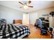 Bedroom with hardwood floors, a ceiling fan, and two closets at 1250 Chichester St, Orlando, FL 32803