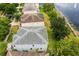 Aerial view of home showcasing roofline and backyard at 12666 Moss Park Ridge Dr, Orlando, FL 32832