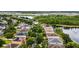 Aerial view of houses and a lake in a residential neighborhood at 12666 Moss Park Ridge Dr, Orlando, FL 32832
