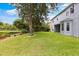 Large backyard with pond view and lush lawn at 12666 Moss Park Ridge Dr, Orlando, FL 32832