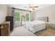 Bedroom with ceiling fan and window with natural light at 12666 Moss Park Ridge Dr, Orlando, FL 32832