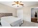 Bedroom with ceiling fan and double door closet at 12666 Moss Park Ridge Dr, Orlando, FL 32832