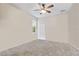 Simple bedroom with ceiling fan and window at 12666 Moss Park Ridge Dr, Orlando, FL 32832